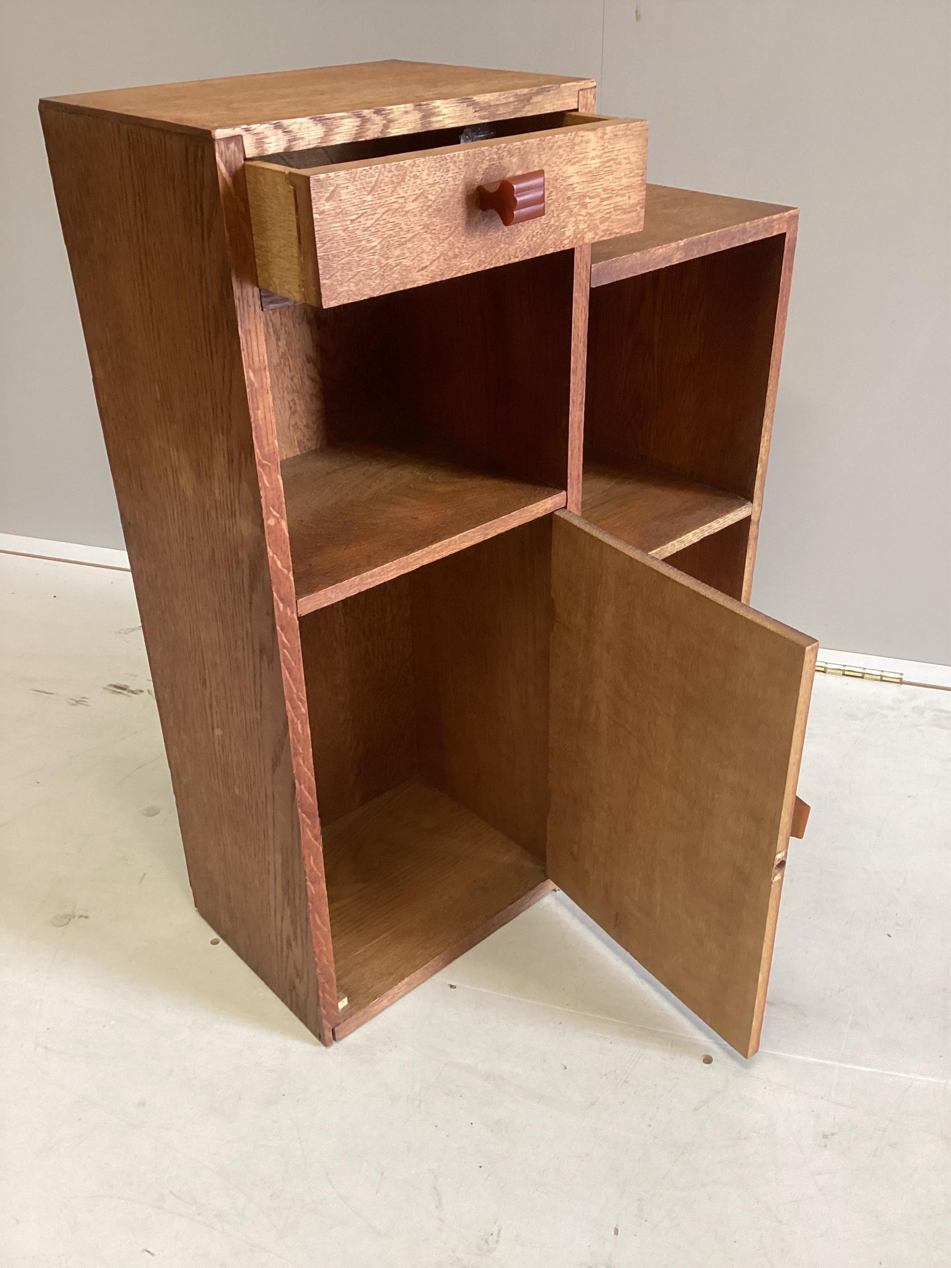 A mid century Betty Joel style oak bedside cabinet, width 52cm, depth 20cm, height 69cm. Condition - fair